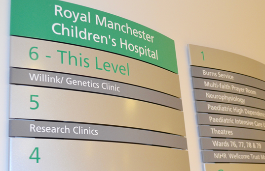 A sign to the genetics department in Royal Manchester Children's Hospital