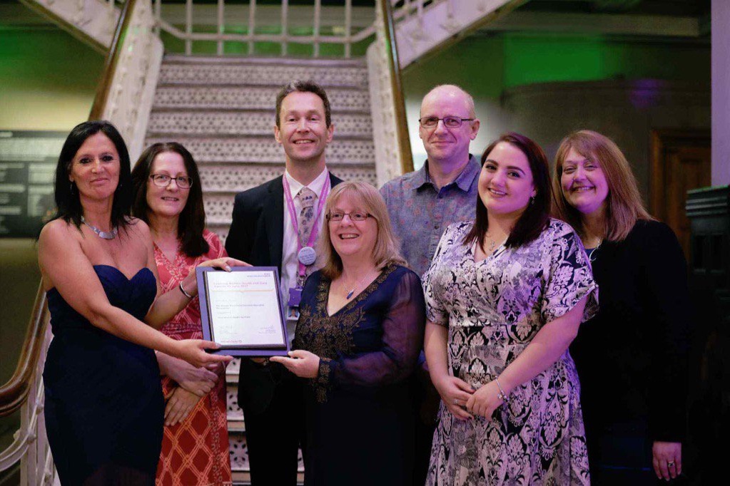 Glenda Beaman receiving her award